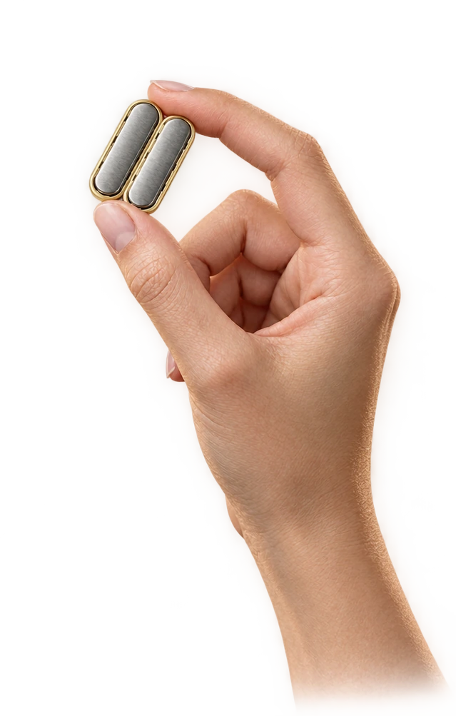 The two small MagDI magnets shown held between fingers