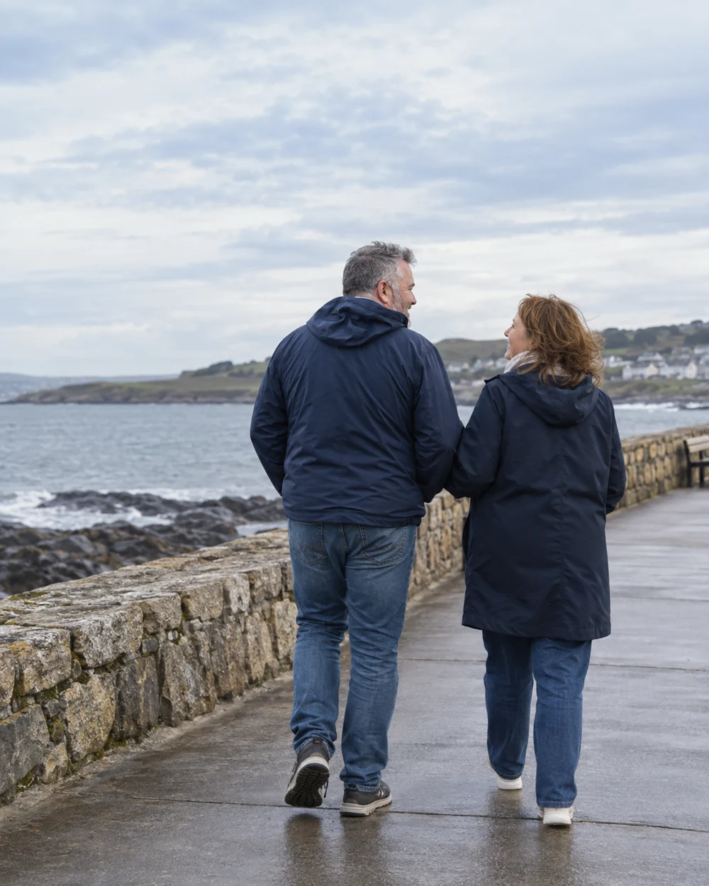 Illustrative scene of a couple enjoying a coastal walk